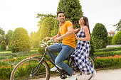 Romantic scene of a couple riding a bike