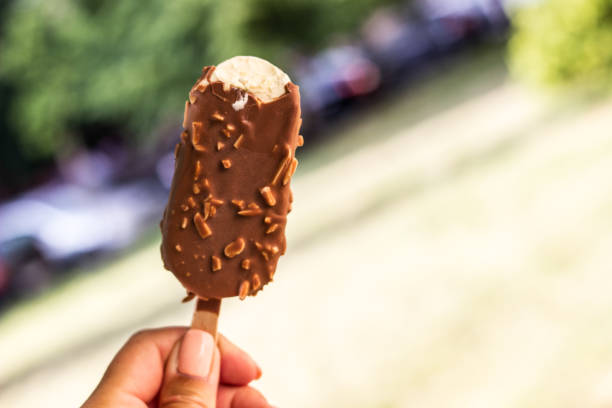 istock Woman holding chocolate ice cream 1418447205