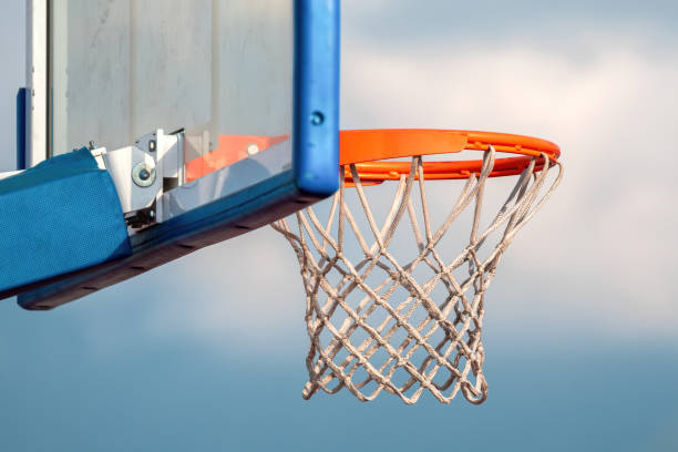 istock Basketball hoop purpose over blue cloudy sky 1418455520