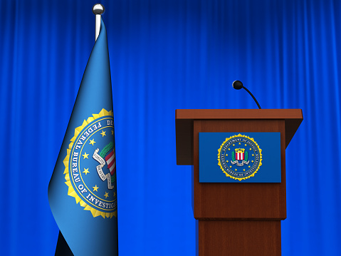 Federal Bureau of Investigation (FBI) flag rostrum with microphone. Digitally generated image