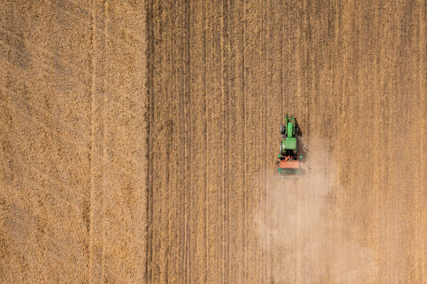 istock High angle view of a tractor on the field 1418457711