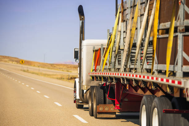 istock Semi Truck Trailer Oversize Cargo Secured with Lashing Straps 1418464522