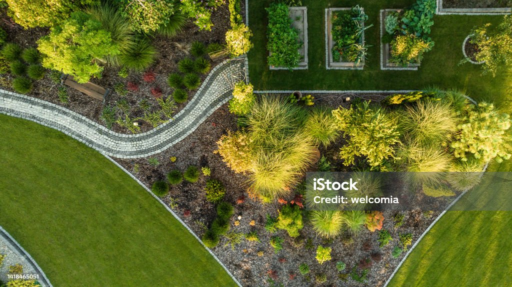 Aerial View of Modern Backyard with Vegetable Garden Aerial View of Modern Beautiful Backyard Garden with Three Vegetables Wooden Pots. Summer Time in a Garden. Landscaped Stock Photo