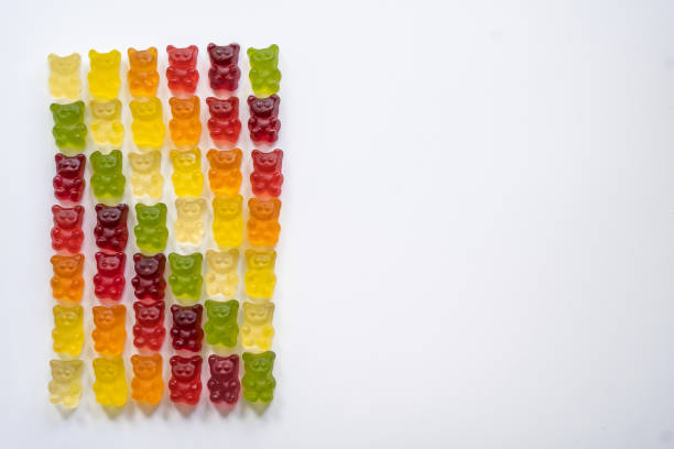 istock colorful gummy bears arranged in rows by color as a gradient on a light background 1418467964