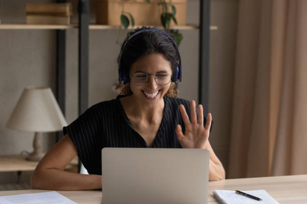 istock Happy young woman starting web camera call. 1418468140