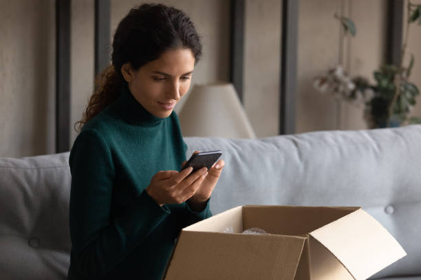 istock Beautiful millennial client typing review for internet service. 1418468408