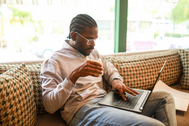 istock black middle aged man studying with laptop in cafe 1418470983