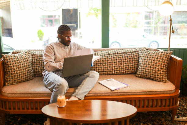 istock black middle aged man studying with laptop in cafe 1418471137