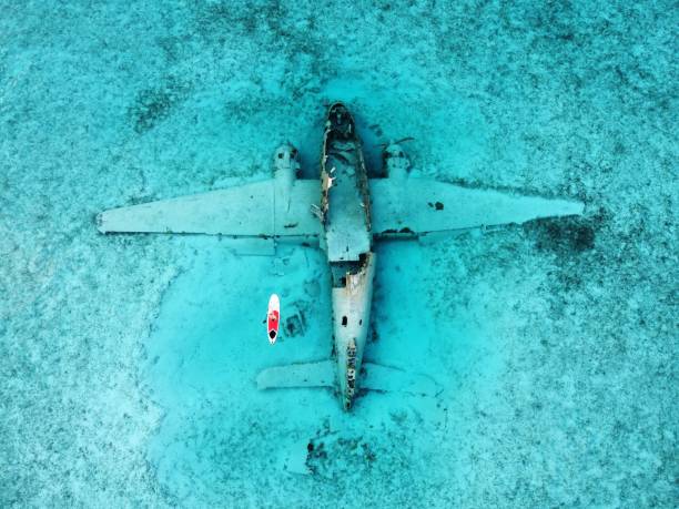 istock Paddleboarding Around the Norman's Cay Plane Wreck, Bahamas 1418474548