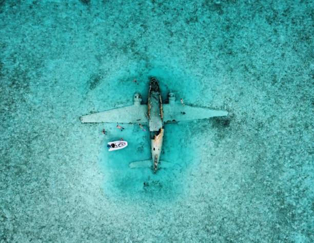 istock A Dinghy and People Snorkeling at the Norman's Cay Plane Wreck 1418474549