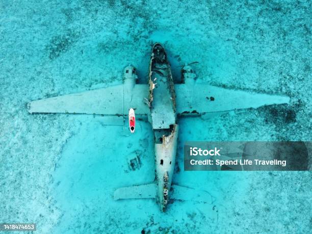 Paddleboarding Around A Plane Wreck In The Exumas Bahamas Stock Photo - Download Image Now