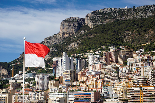 Panorama of Monte Carlo with a flag of Monaco.