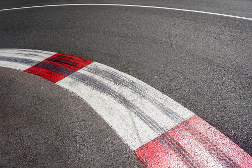 empty asphalt road in modern circuit in blue cloud sky