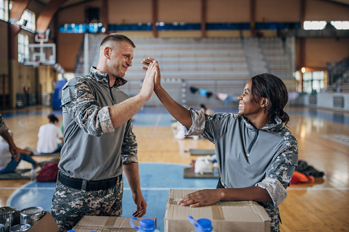 A closeup of a handshake of a soldier and a doctor