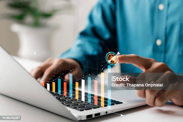 Businessman Analyzing Companys Financial Balance Sheet Working With Digital Augmented Reality Graphics Businessman Calculates Financial Data For Longterm Investment Stock Photo - Download Image Now