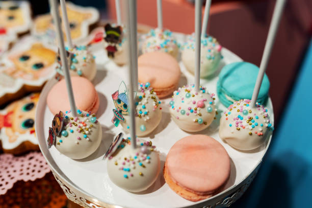 istock colorful round candies on sticks and macaroons 1418477755