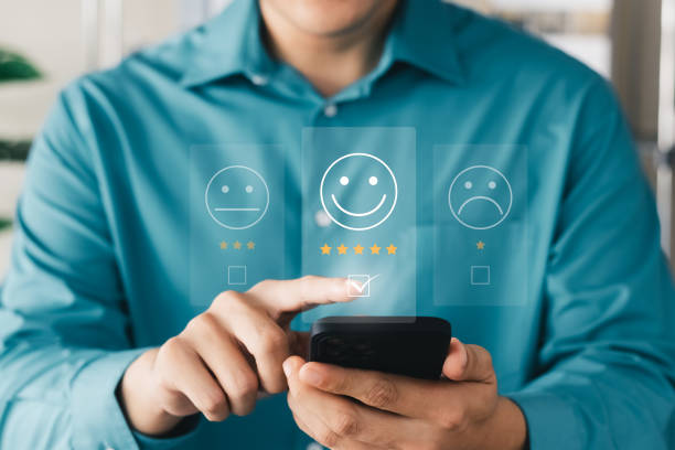 istock User give rating to service experience on online application, Customer review satisfaction feedback survey concept, Customer can evaluate quality of service leading to reputation ranking of business. 1418478285