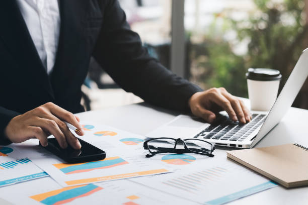 istock businessman executive analyzing and planning business performance from financial data, analyzing finance data and economic growth graph chart. 1418478867