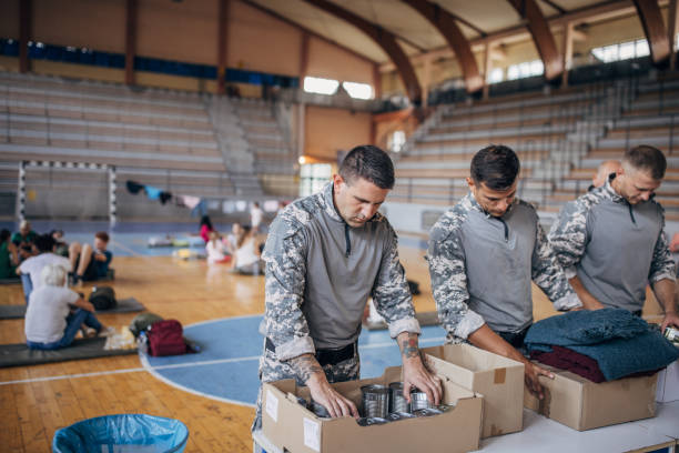 istock Soldiers preparing donations for civilians 1418479050