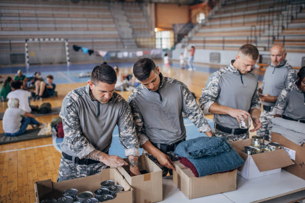 istock Soldiers preparing donations for civilians 1418479076