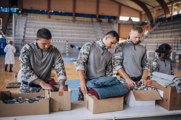 istock Soldiers preparing donations for civilians 1418479186