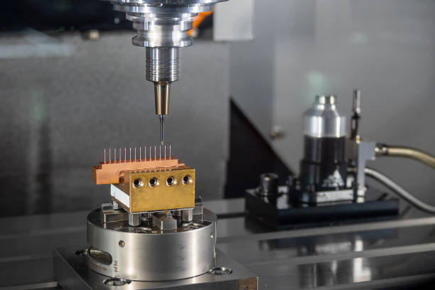 istock The CNC milling machine cutting the copper electrode parts with solid ball end mill. 1418479449
