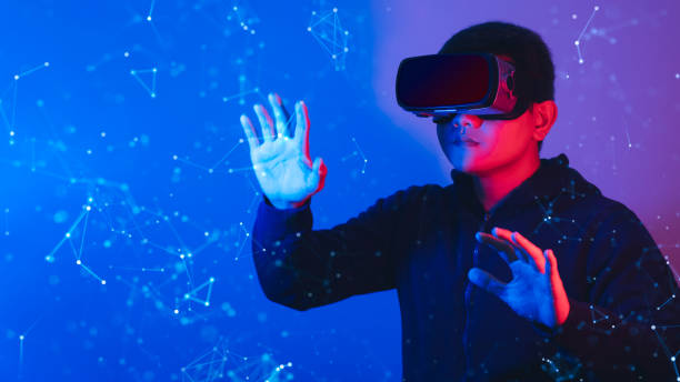 istock Young man wearing VR goggles. Metaverse technology virtual reality concept. Virtual Reality Device, Simulation, 3D, AR, VR, Innovation and Technology of the Future on Social Media. 1418479468