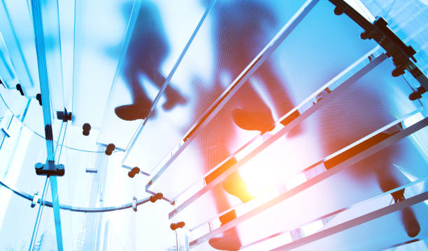 istock people on glass staircase 1418480408