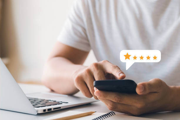 istock User give rating to service experience on online application, Customer review satisfaction feedback survey concept, Customer can evaluate quality of service leading to reputation ranking of business. 1418480752