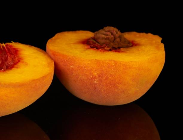 istock yellow peaches lie on a black background fruit 1418481464