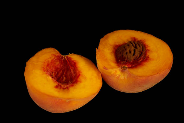 istock yellow peaches lie on a black background fruit 1418481477