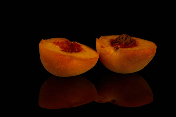 istock yellow peaches lie on a black background fruit 1418481500