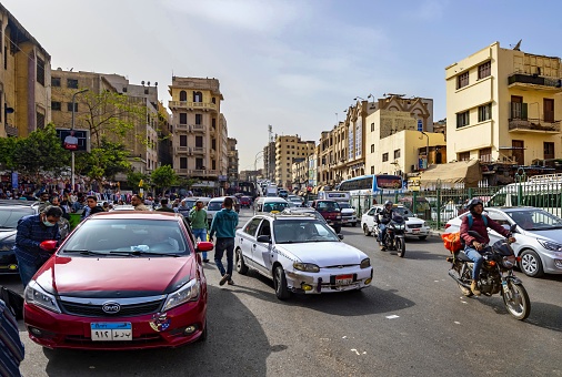 POV through old vehicle to city street in Havana City