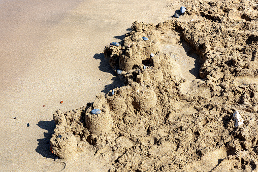 Sand castle made by little children by the sea in Rhodes Island, Greece.