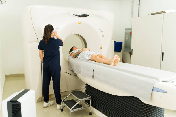 istock Nurse starting a brain tomography at the imaging diagnostic center 1418490960