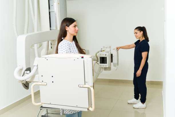 istock Caucasian female radiologist getting an x-ray image at the diagnostic lab 1418491327