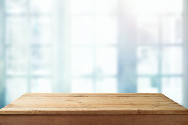 istock Empty wooden  table over window blurred  background. Kitchen interior mock up for design and product display 1418492955