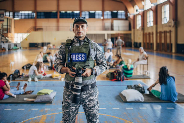 istock Army press with civilians after natural disaster 1418493319