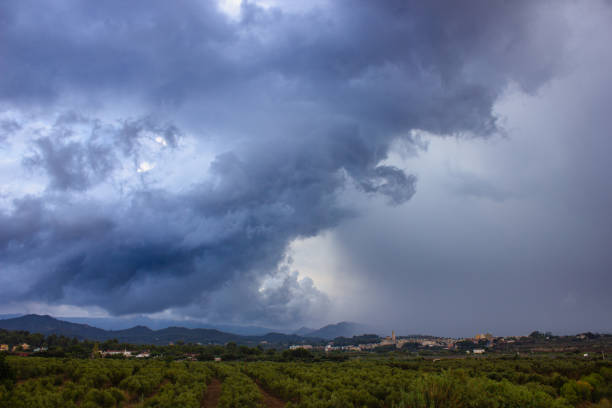 Summer storm Summer storm, with clouds about to dump rain on a small town in the Mediterranean hinterland. storm cloud sky dramatic sky cloud stock pictures, royalty-free photos & images