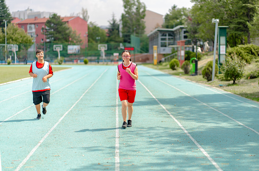 Young  athletes with Down syndrome running a track race