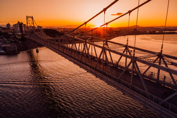 Cable stayed bridge with sunset sky in Florianopolis, Brazil. Aerial drone view Cable stayed bridge with sunset sky in Florianopolis, Brazil. Aerial drone view florianópolis stock pictures, royalty-free photos & images