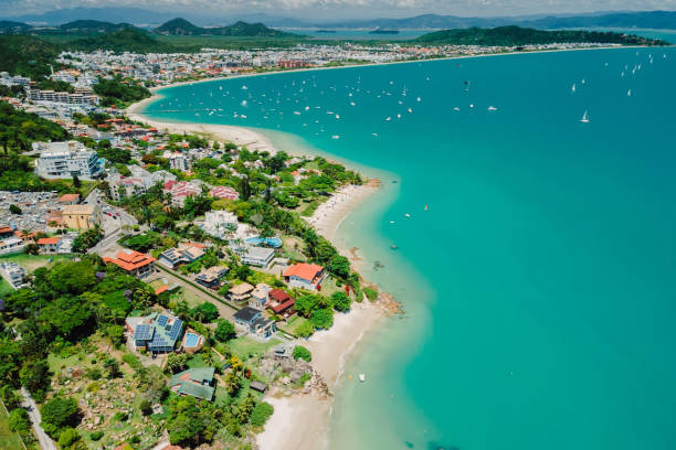 Tropical holiday beach with Jurere town. Aerial view of Florianopolis Tropical holiday beach with Jurere town. Aerial view of Florianopolis florianópolis stock pictures, royalty-free photos & images