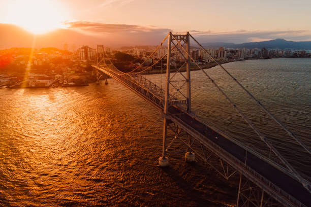 istock Cable bridge with sunset light in Florianopolis, Brazil. Aerial view 1418498146