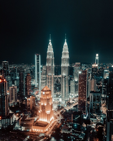 A vertical shot of Kuala Lumpur skyline at night