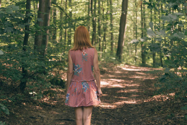 Adult female enjoy walking in forest