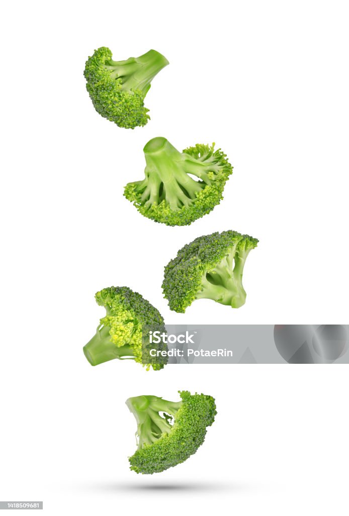 Piece of broccoli falling in the air isolated on white Piece of broccoli falling in the air isolated on white background. Broccoli Stock Photo