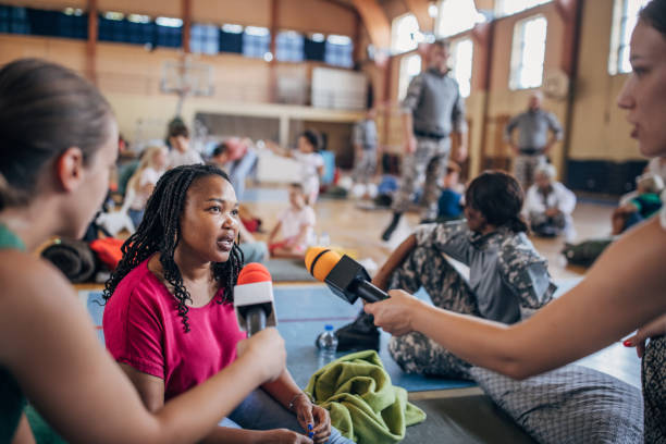 istock Press talking to civilians in shelter 1418513388