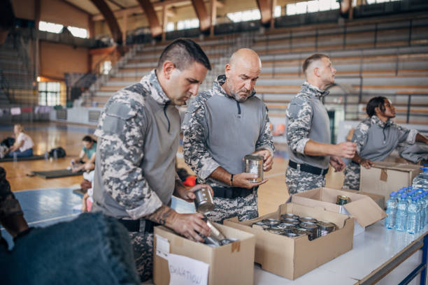 istock Soldiers preparing donations for civilians 1418513473