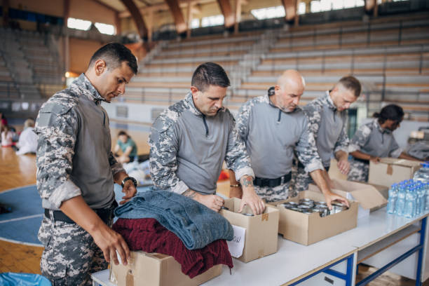 istock Soldiers preparing donations for civilians 1418513554