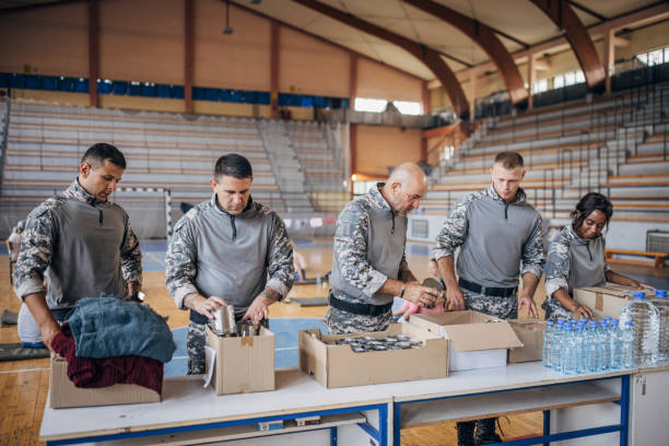 istock Soldiers preparing donations for civilians 1418513703